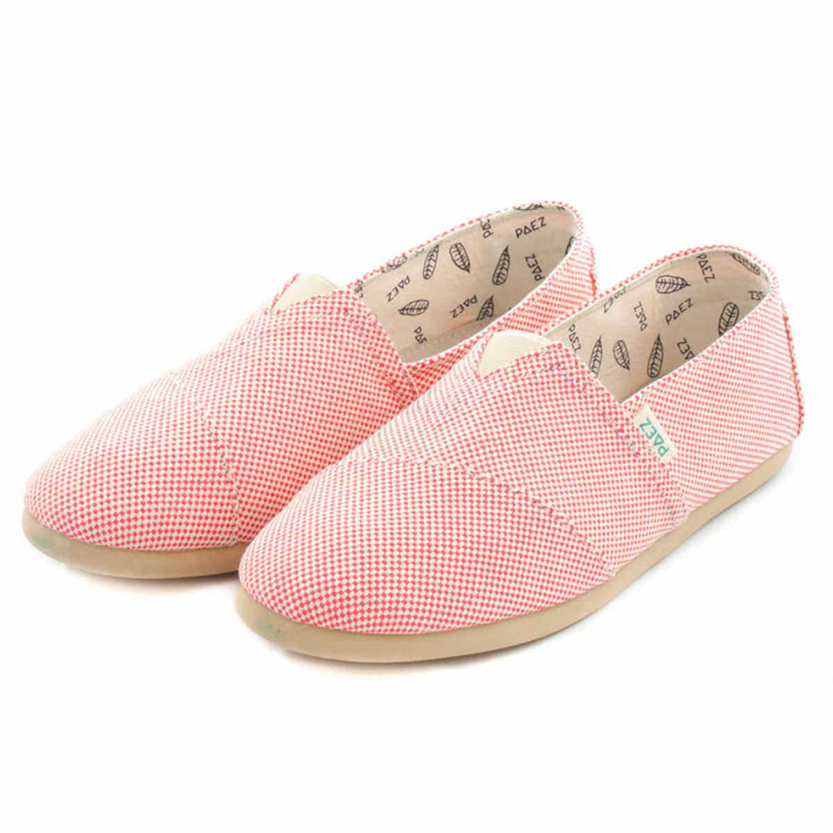 A close-up view of a pair of fuxia PAEZ Panama espadrille shoes for women, showing their soft woven fabric construction and neutral soles. The PAEZ logo is visible on the side.
