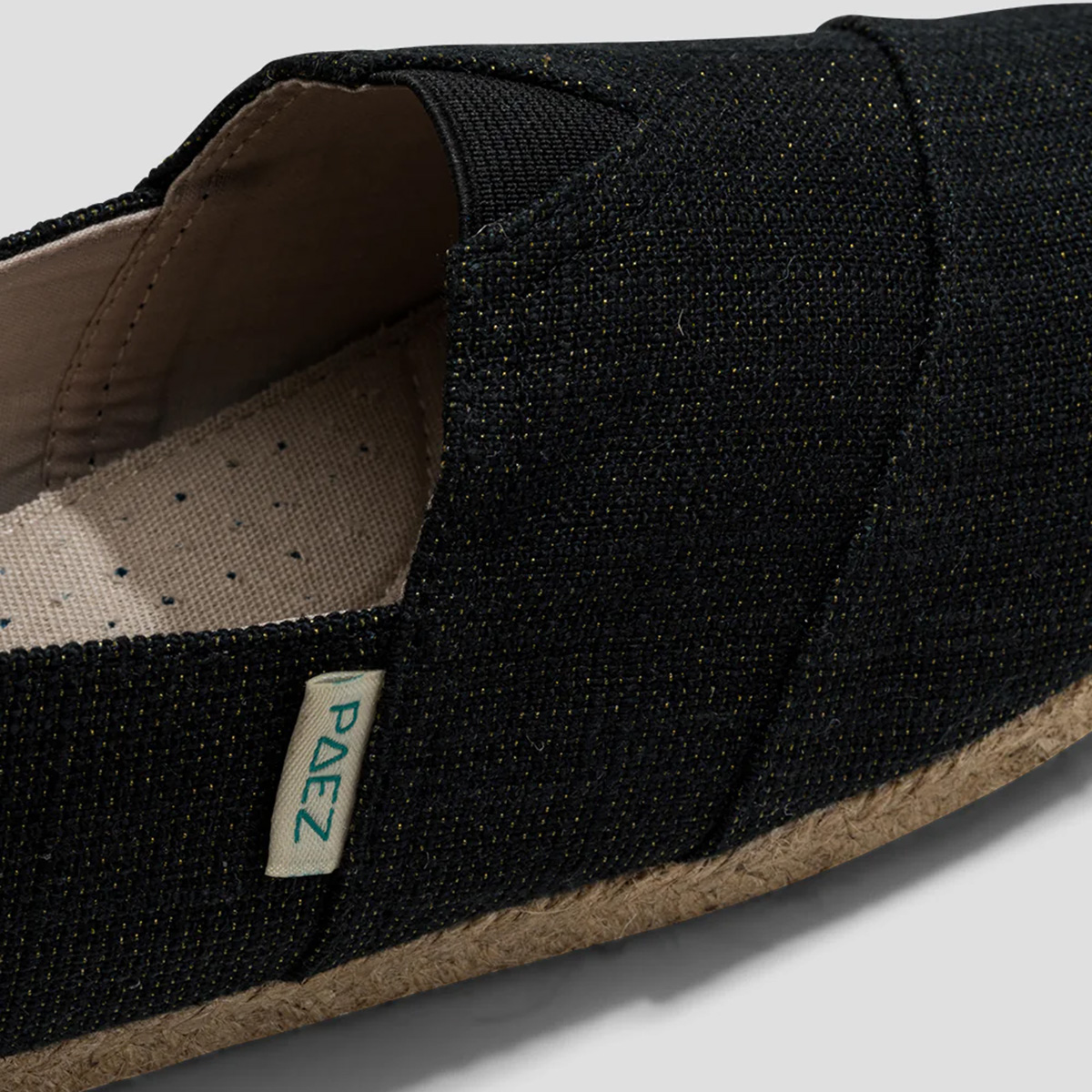 Close-up view of the Classic Day Sparks Charcoal PAEZ Espadrilles, showcasing the fabric texture and brand tag.