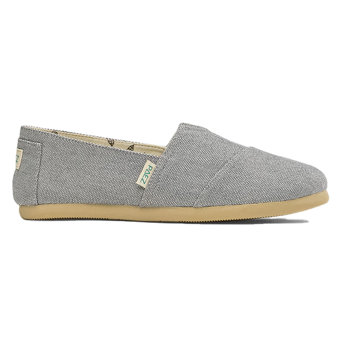 A side view of a PAEZ Dove Combi slip-on shoe for women, featuring a minimalist grey fabric upper and a light brown rubber sole.