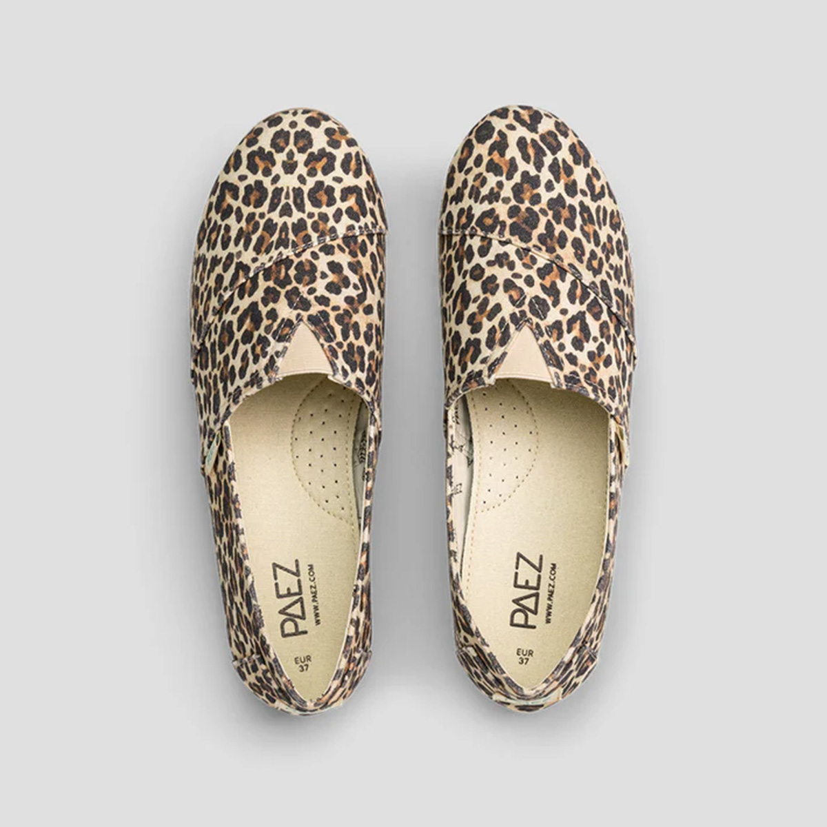 A top-down view of PAEZ espadrilles featuring a bold leopard print design, emphasizing their wild and stylish aesthetic.